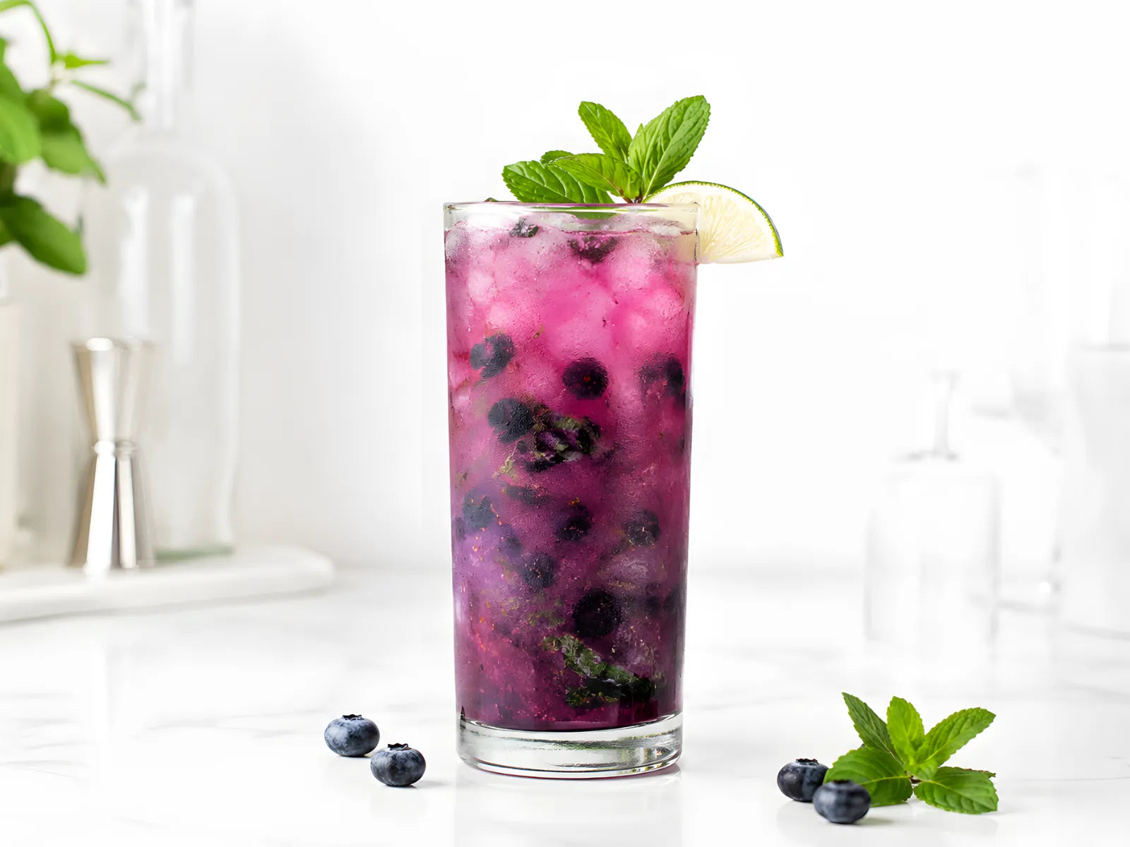 blueberry mojito in a highball glass with crushed ice