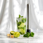 rubber head muddler next to a cocktail