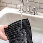 small bar mat being washed