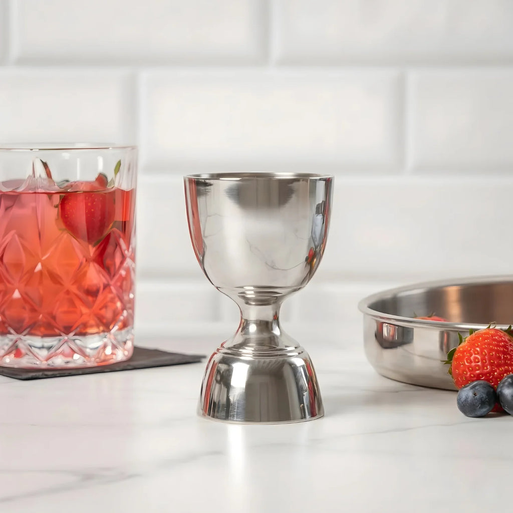 bell jigger next to a cocktail