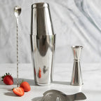 4-piece Boston shaker cocktail set on a home bar counter