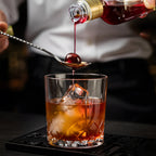 bartender using a teardrop bar spoon