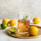 diamond cut mixing glass filled with a cocktail