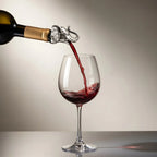 elephant pourer pouring wine from a bottle