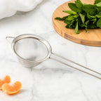 fine mesh strainer on a home bar counter