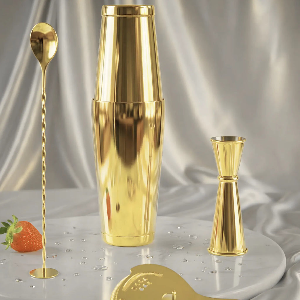 gold 4-piece Boston shaker cocktail set on a home bar counter