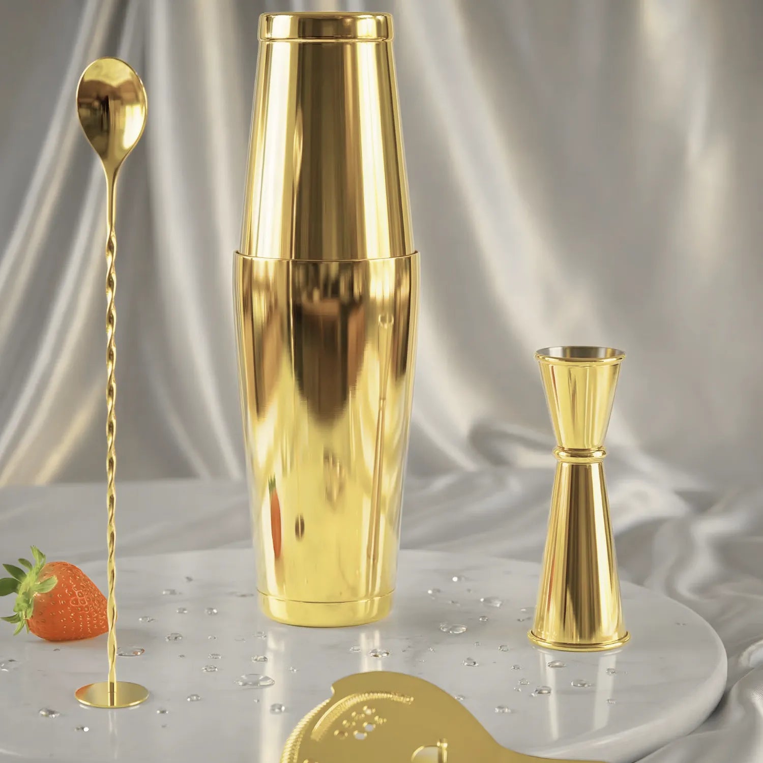 gold 4-piece Boston shaker cocktail set on a home bar counter