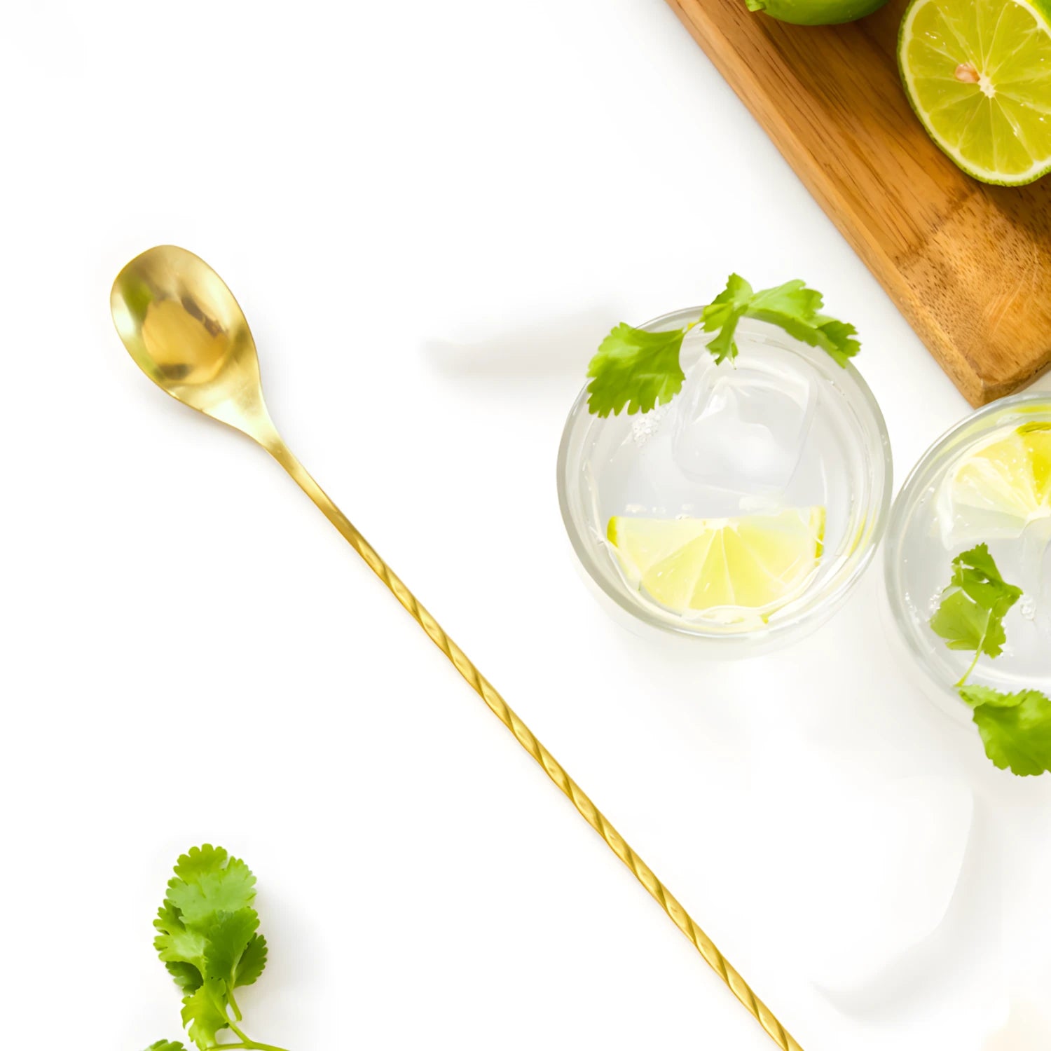 gold teardrop bar spoon on a home bar counter