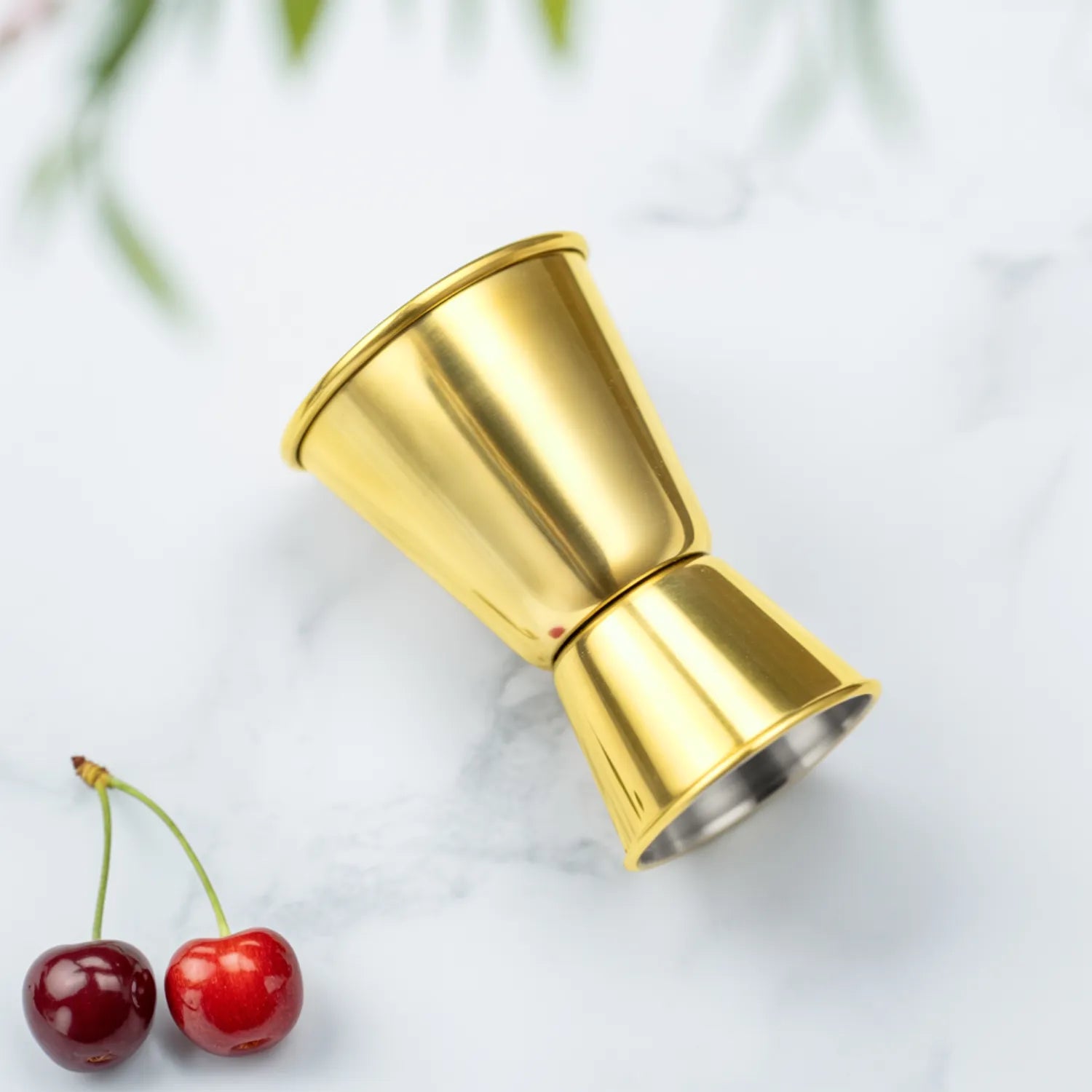 gold classic jigger on a home bar counter