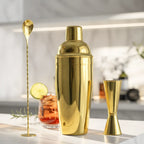 gold 3-piece cobbler shaker cocktail set on a home bar counter