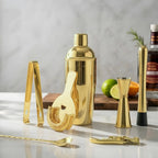 gold 8-piece cobbler shaker cocktail set on a home bar counter