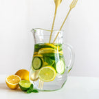 gold fork end bar spoon placed in a cocktail