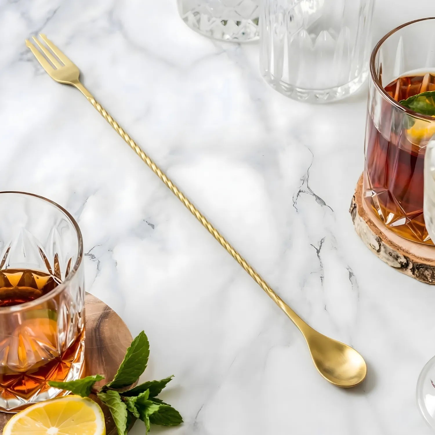gold fork end bar spoon on a home bar counter