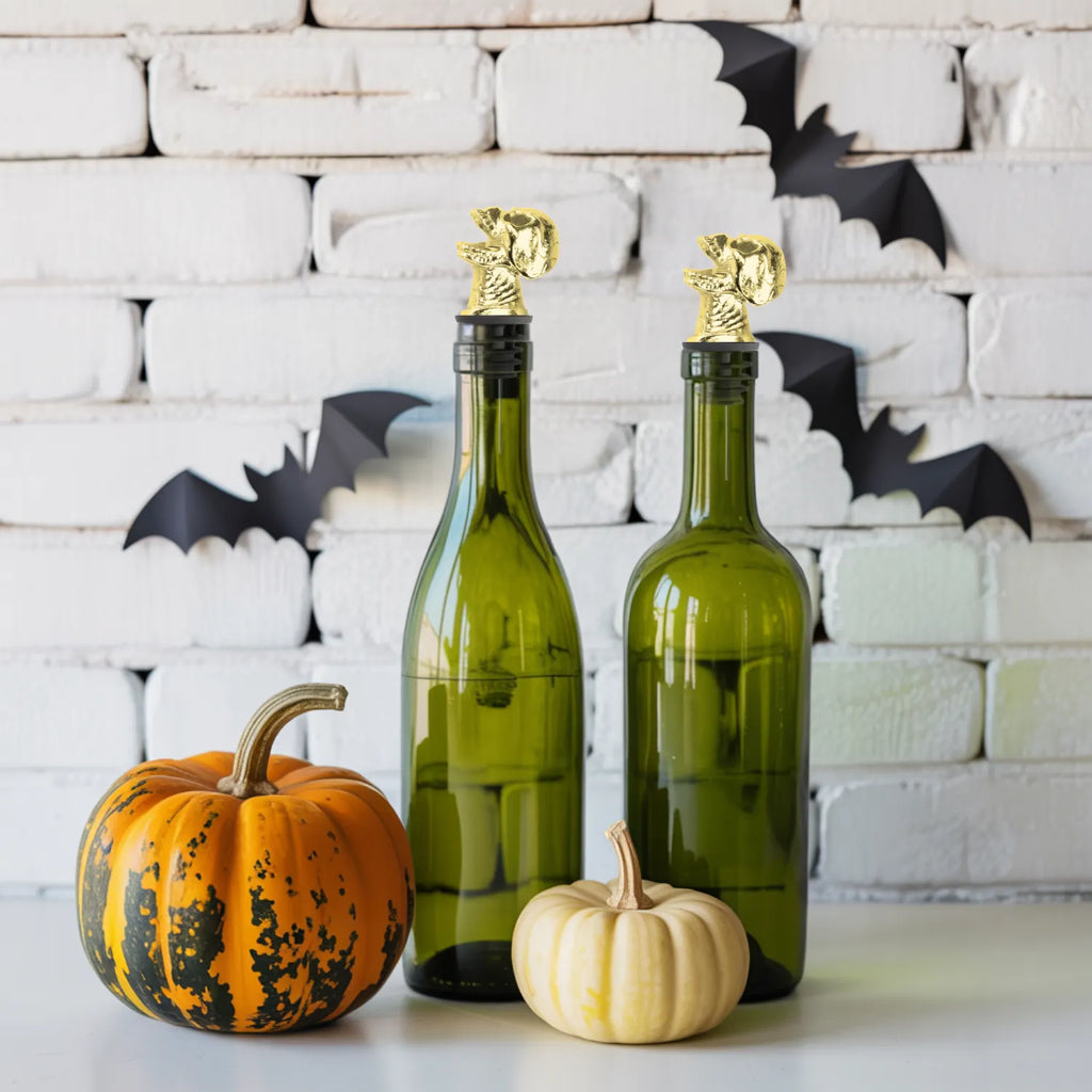 gold skull pourers fitted on bottles