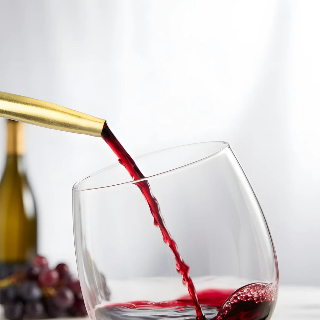 bottle with a gold speed pourer in use