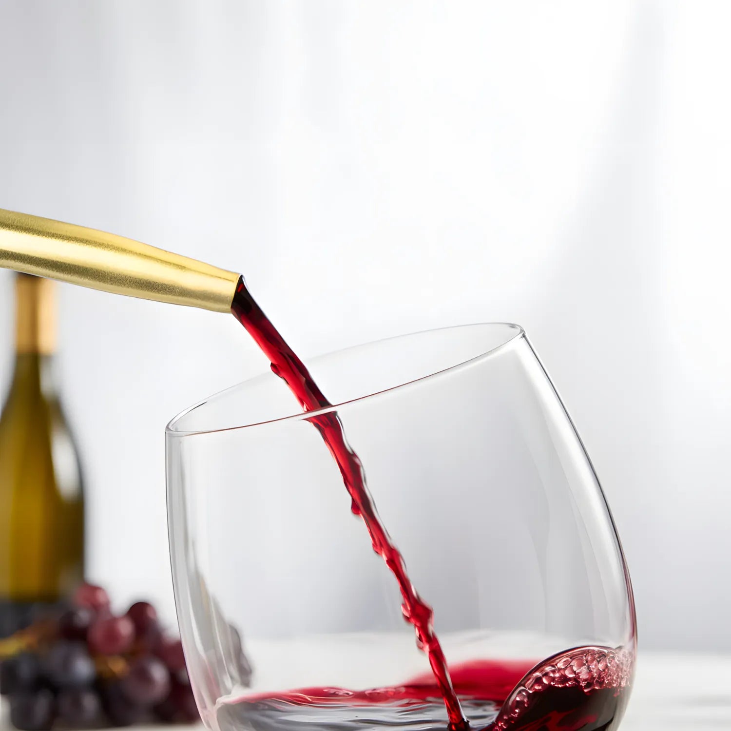 bottle with a gold speed pourer in use