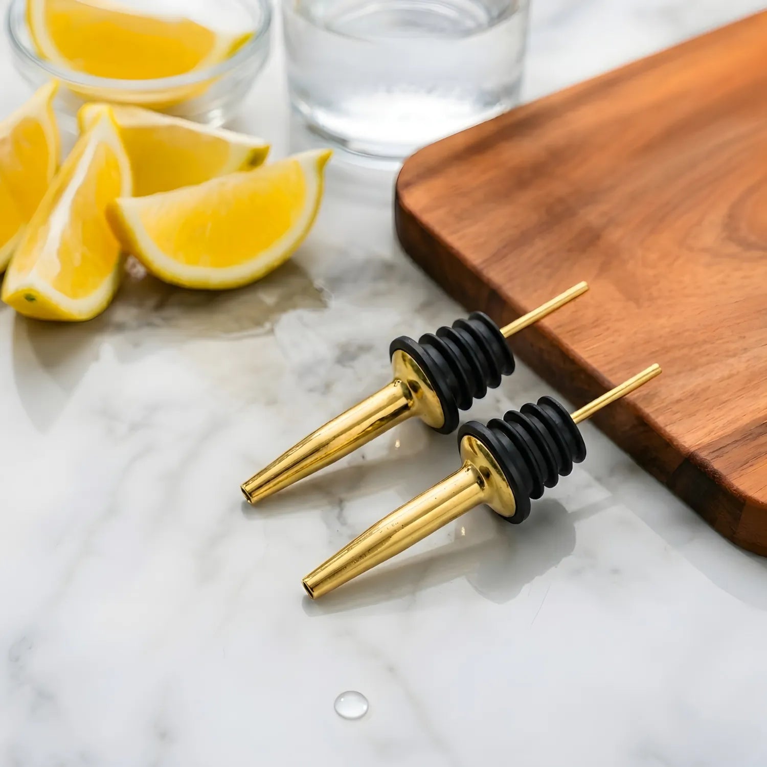 gold speed pourers on a home bar counter
