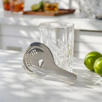 Hawthorne strainer on a home bar counter