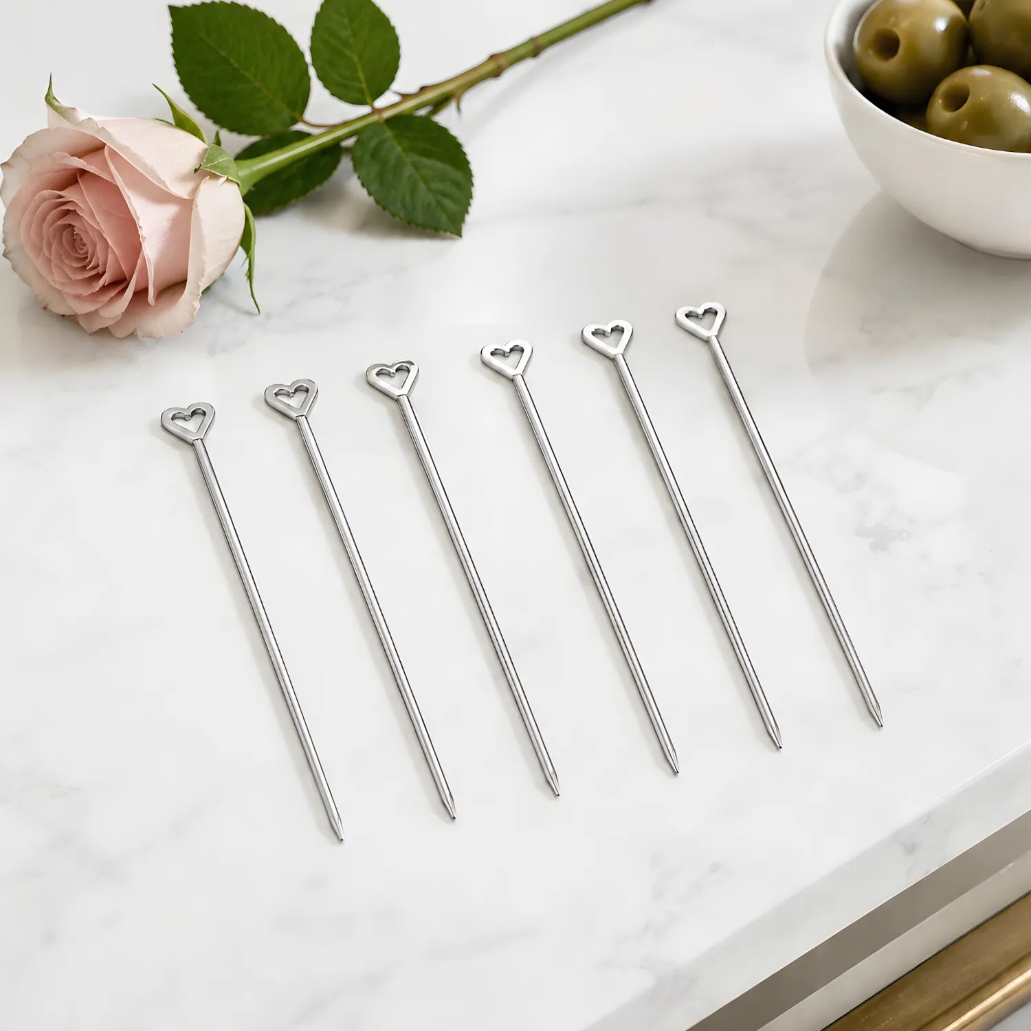 heart cocktail picks on a home bar counter