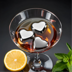 heart stainless steel ice cubes chilling a glass of whiskey