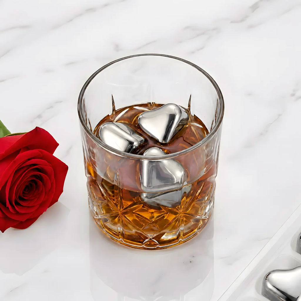 heart shaped stainless steel ice cubes in glass