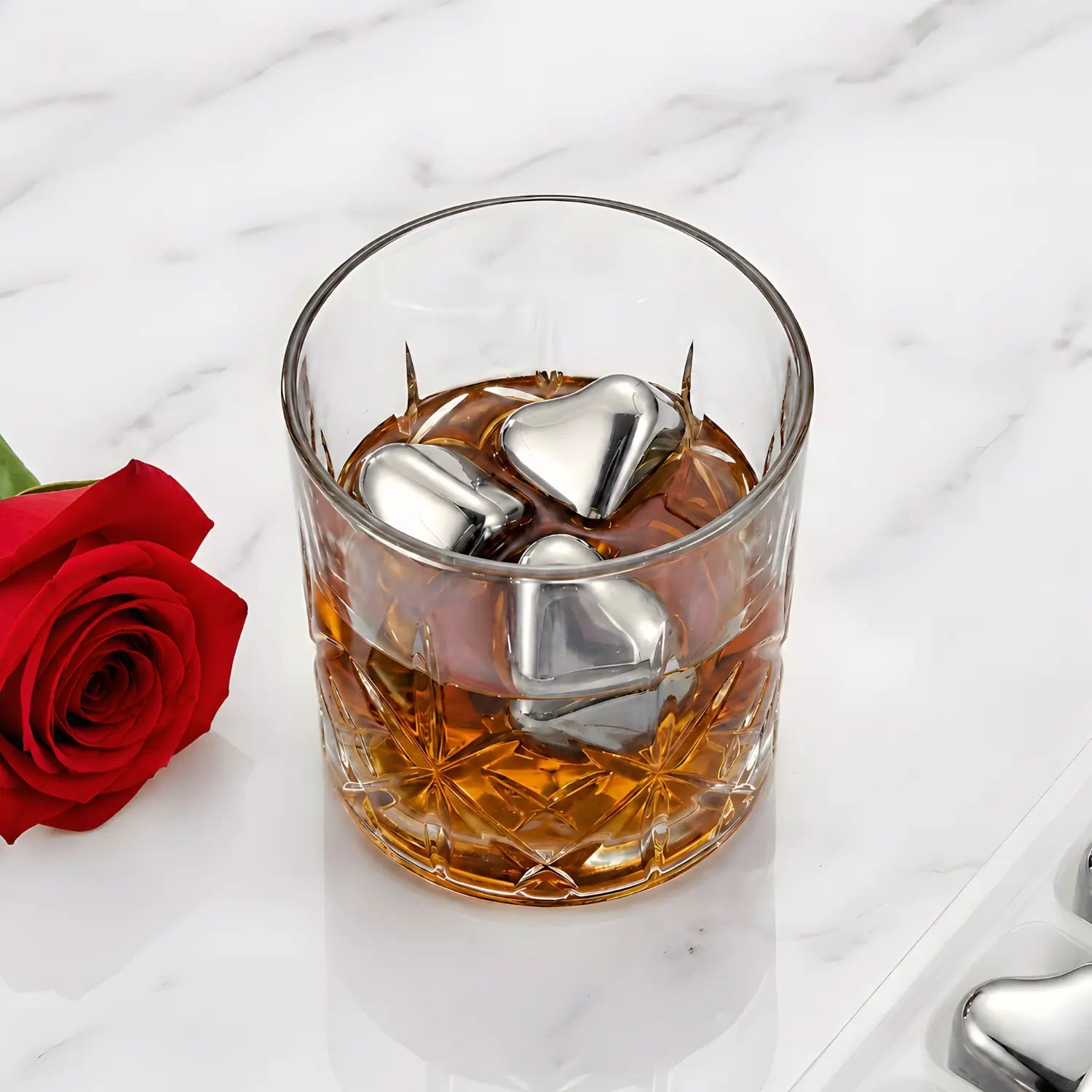 heart shaped stainless steel ice cubes in glass