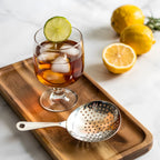 Julep strainer on a home bar counter