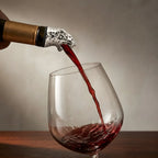 leopard pourer pouring wine from a bottle