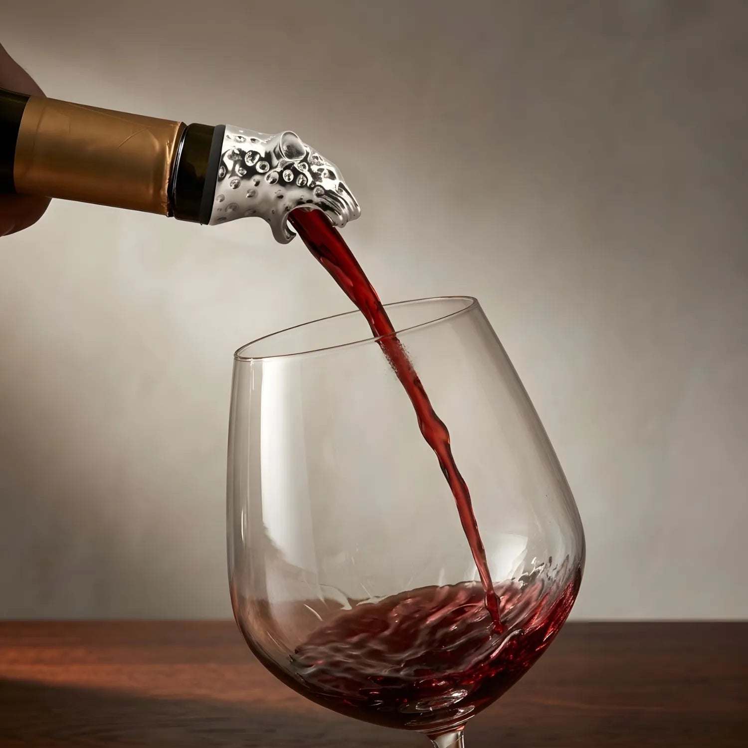 leopard pourer pouring wine from a bottle