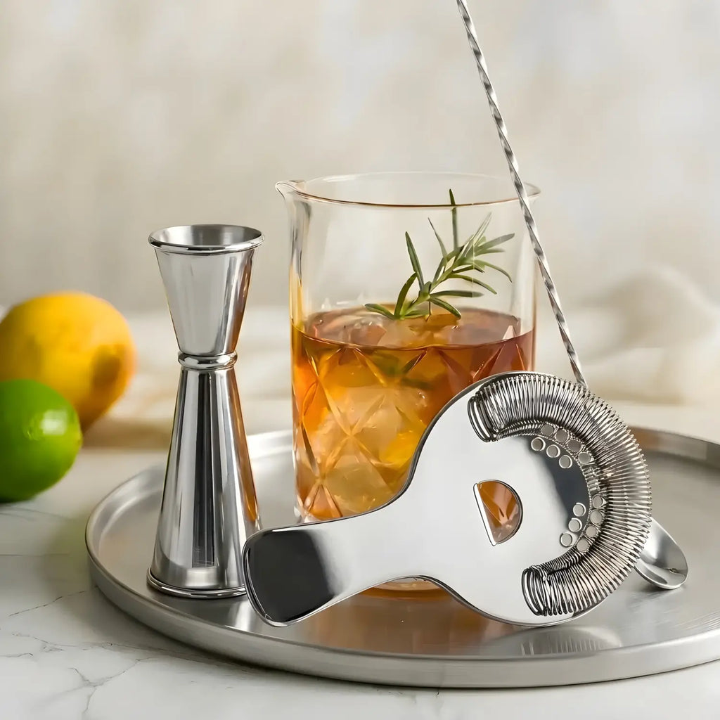 mixing glass cocktail set on a home bar counter