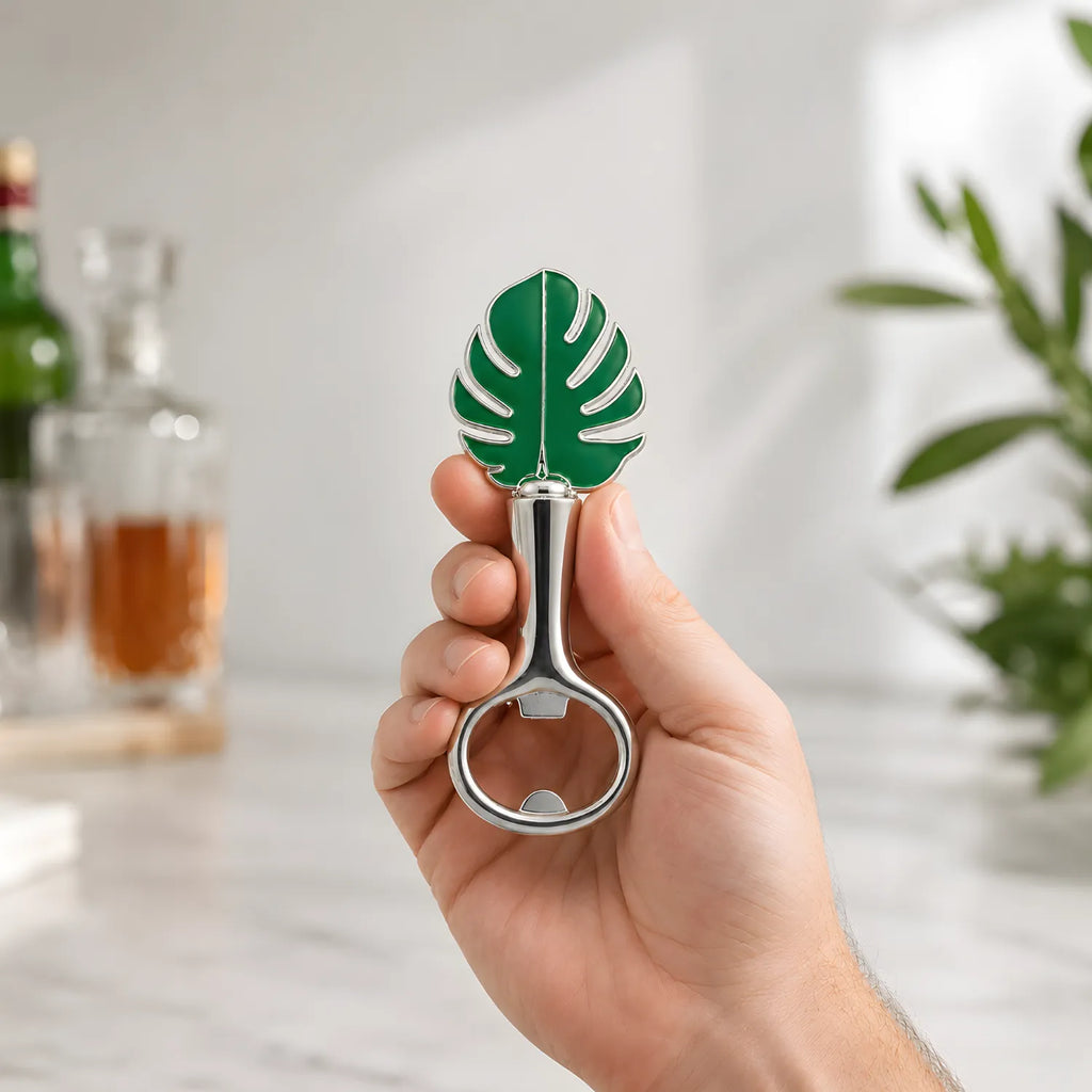 monstera leaf bottle opener in hand