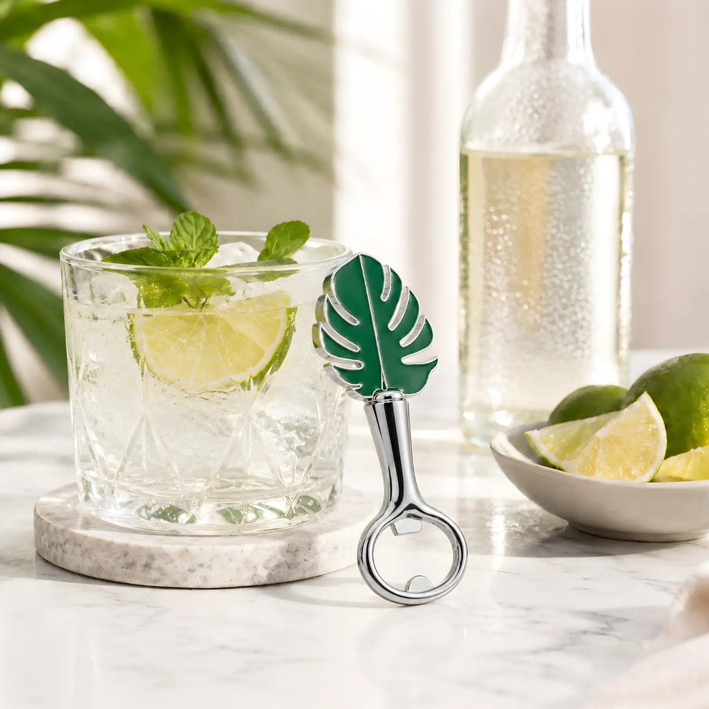 monstera leaf bottle opener leaned against the glass
