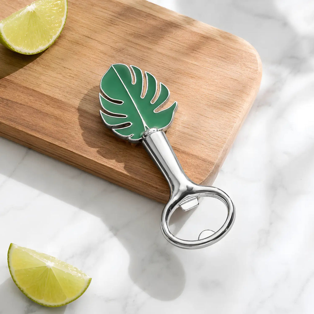 monstera leaf bottle opener on a home bar counter