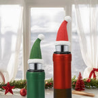 santa hat wine stoppers fitted on bottles