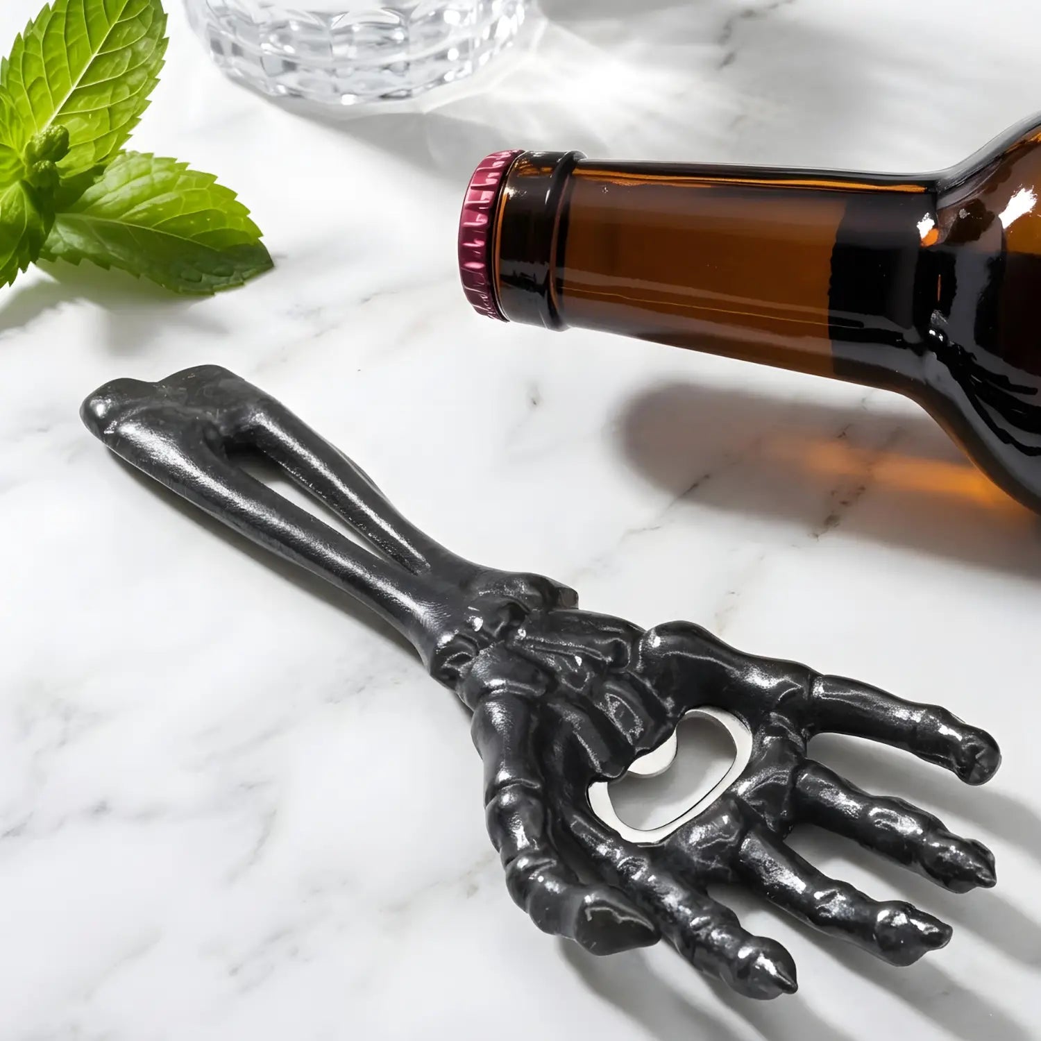 skeleton hand bottle opener on a home bar counter