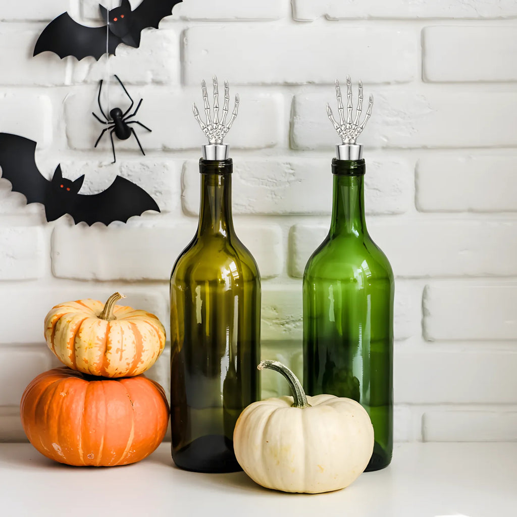 skeleton hand wine stoppers fitted on bottles