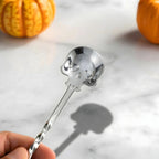 close-up detail of a skull bar spoon
