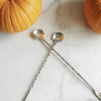 skull bar spoons on a home bar counter