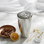 skull strainer resting on a shaker tin