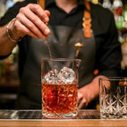 stirring a cocktail in a snowflake mixing glass