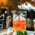 snowflake mixing glass on a home bar counter