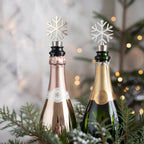 snowflake wine stoppers fitted on bottles