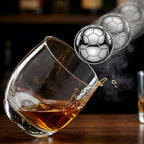 soccer stainless steel ice cube added to whiskey