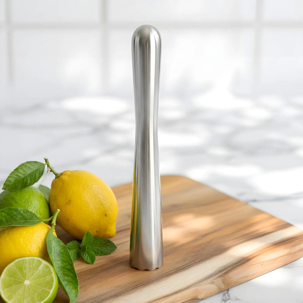stainless steel muddler on a home bar counter